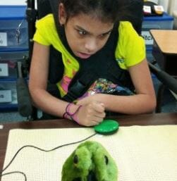 Child using Green Buddy Button